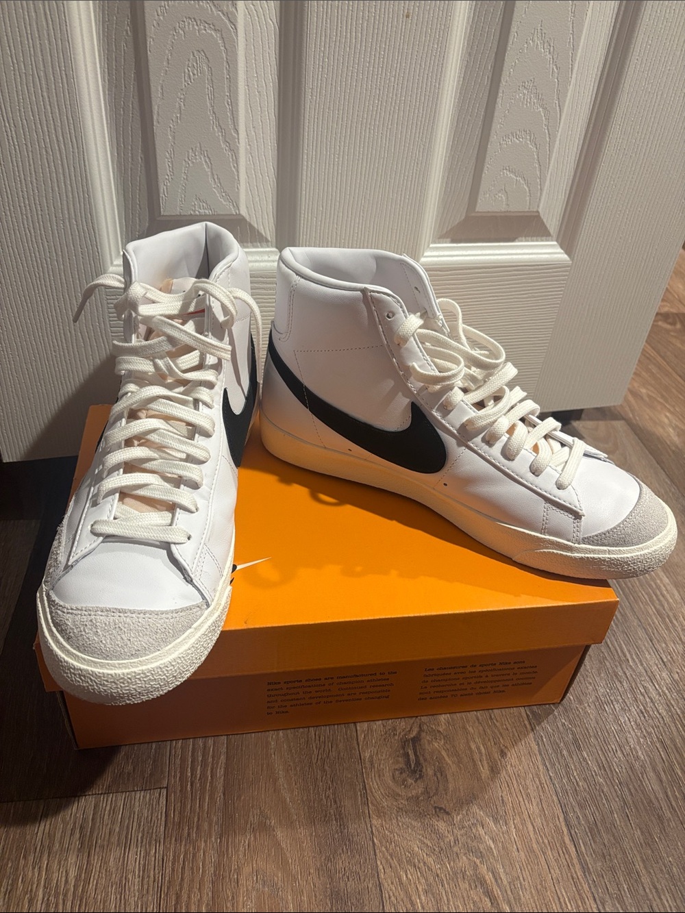 Nike White High-Top Sneakers with Black Swoosh
